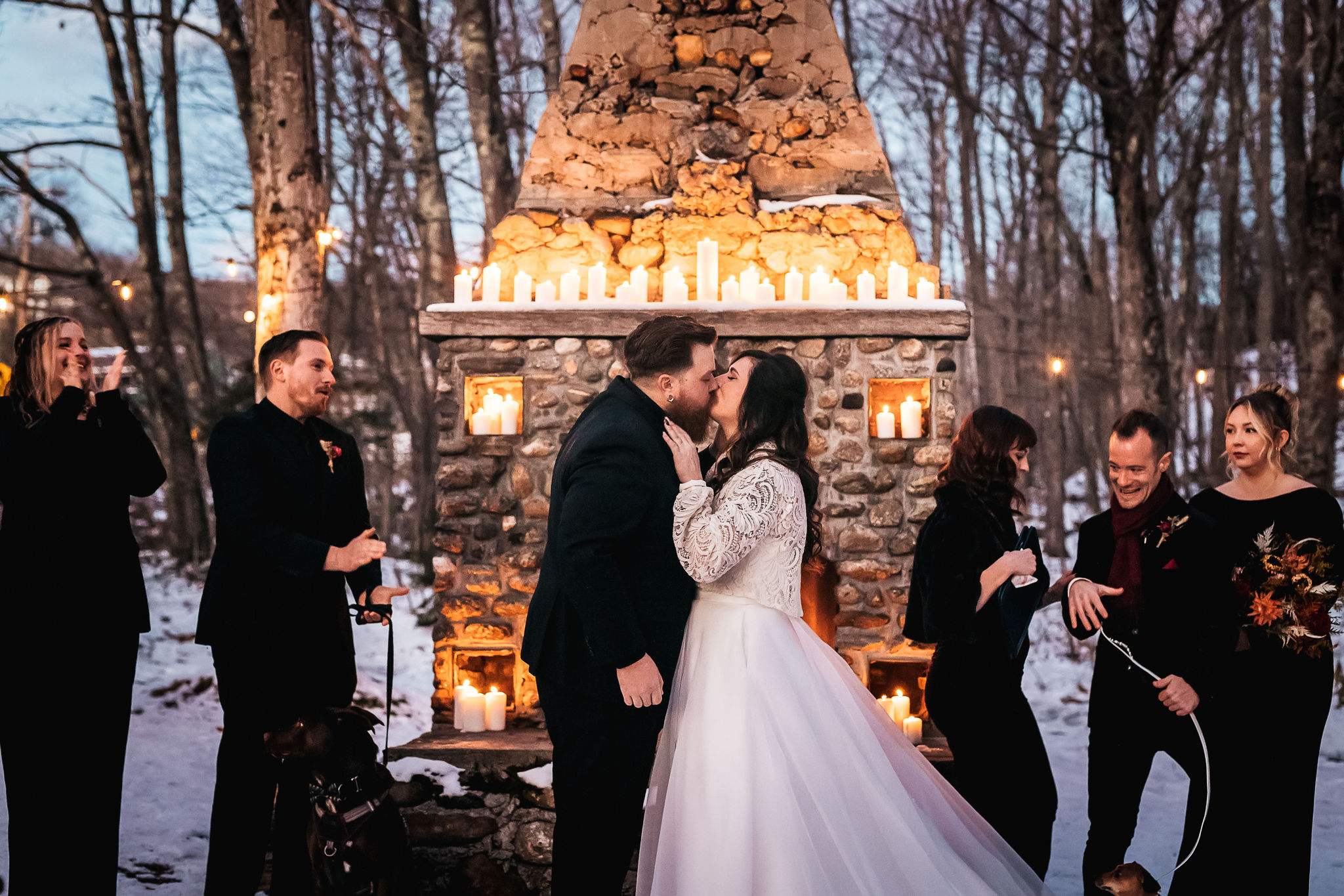 What to Ask a Wedding Photographer - bride and grooms first kiss during winter wedding in Jackson NH by NH wedding photographer Lisa Smith Photography