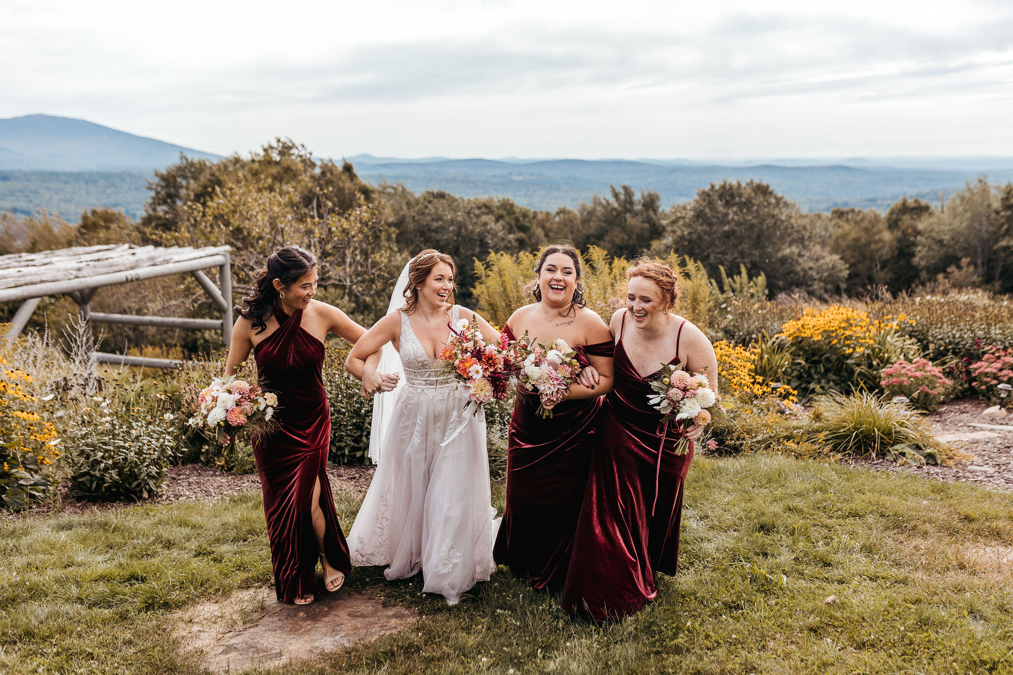 Bridal Party laughing and walking together at Cobb Hill on wedding day by Lisa Smith Photography