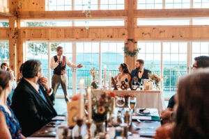 Father of the bride giving a speech to couple