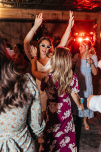 Bride dancing with glasses