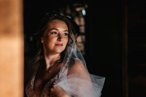 Bride looking out window