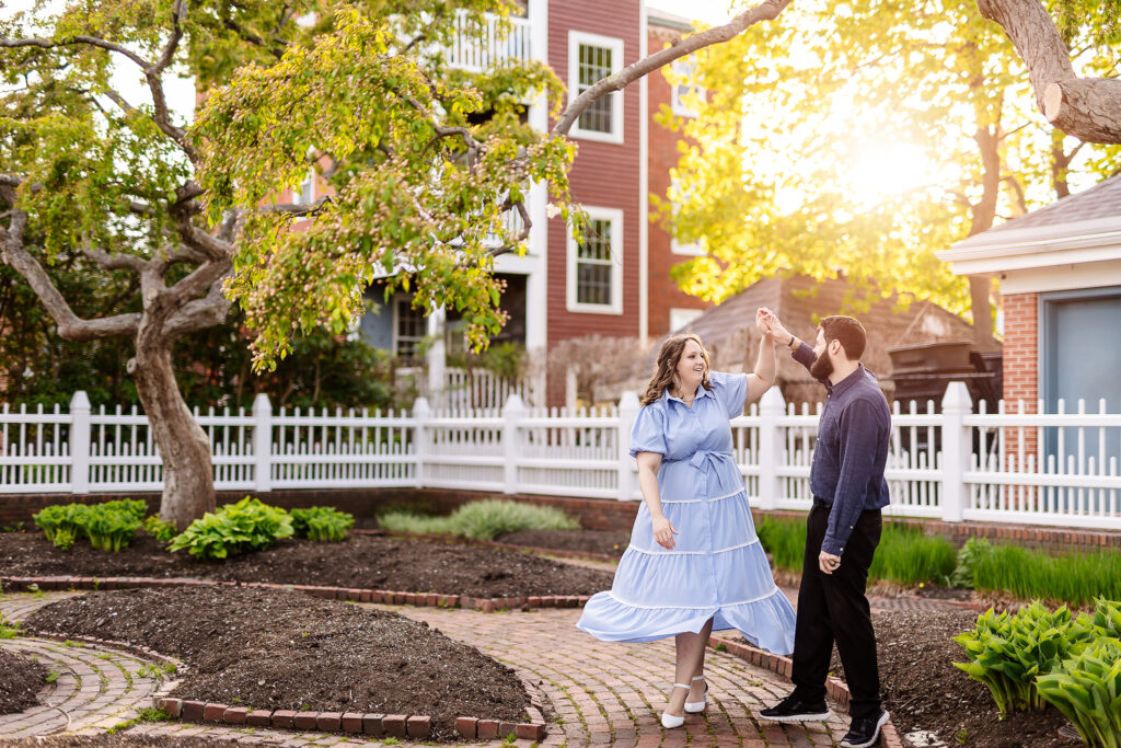 Couple dancing at sunset in Prescott Park in Portsmouth NH Engagement Photos by Lisa Smith Photography 