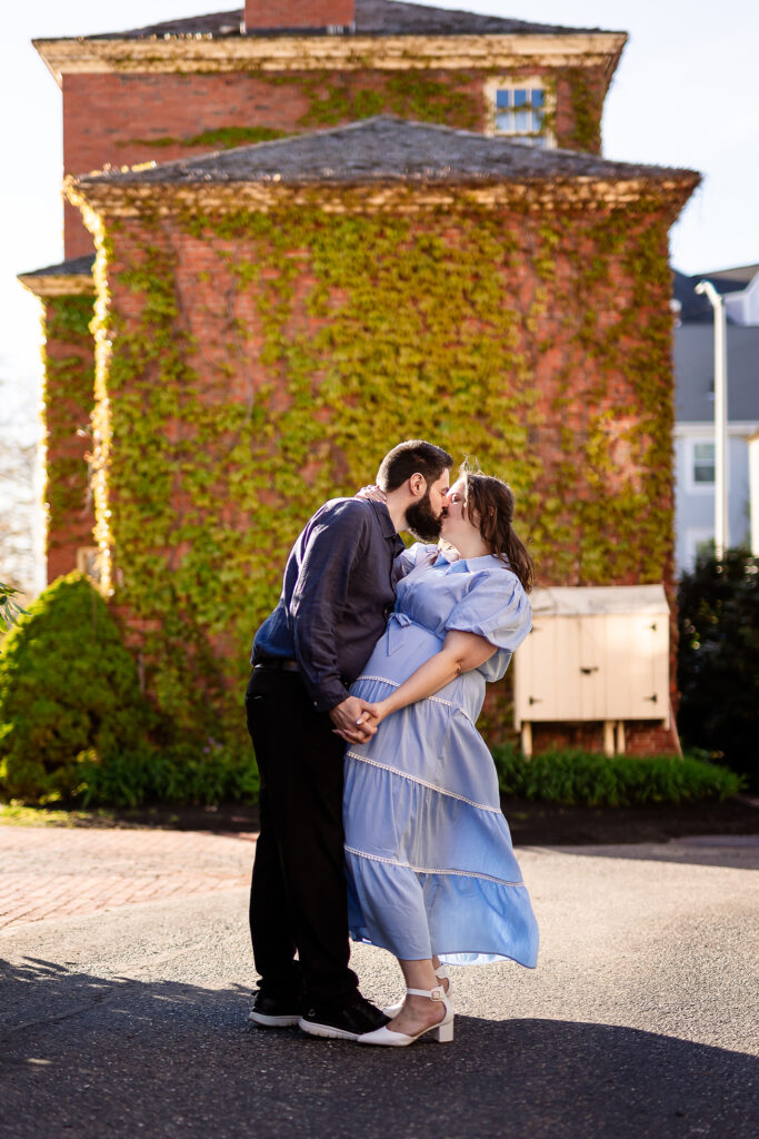 Couple kissing in front of ivy wall in Portsmouth NH Engagement Photos by Lisa Smith Photography 