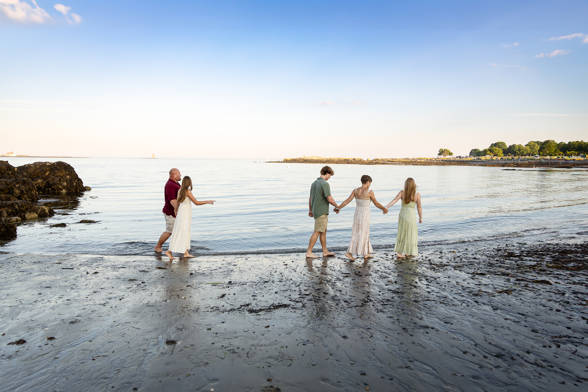 Family walking along the beach at sunset by Lisa Smith Photography