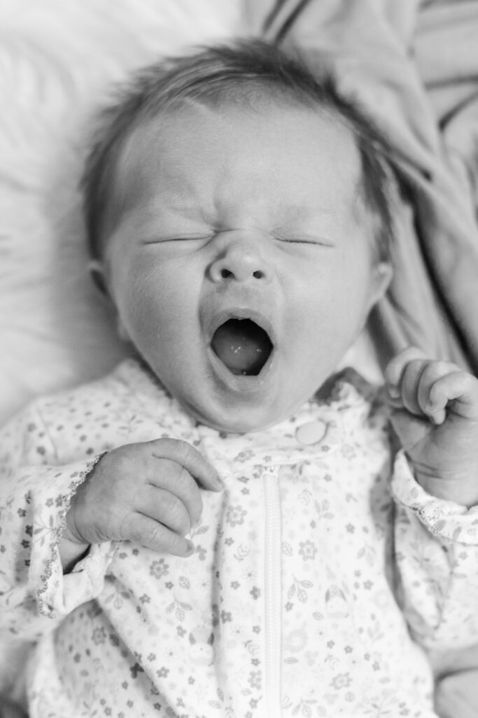 Newborn baby yawning by NH Newborn Photographer Lisa Smith Photography