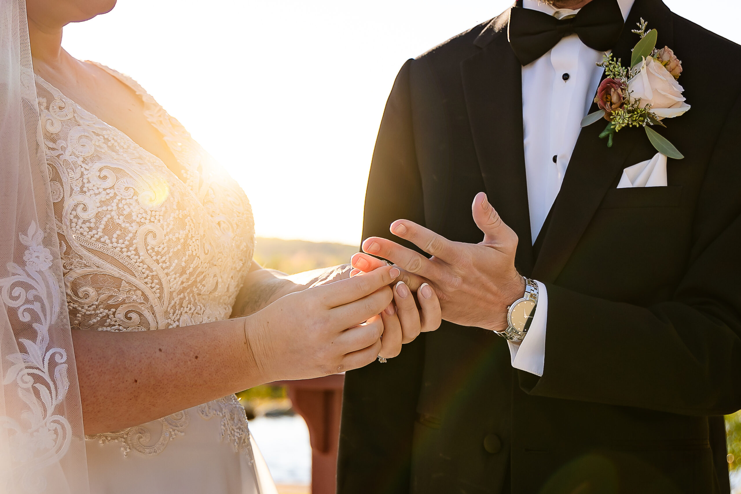 Bride placing ring on grooms hand during wedding ceremony at Pembroke Pines Country Club by nh wedding photographer Lisa Smith Photography