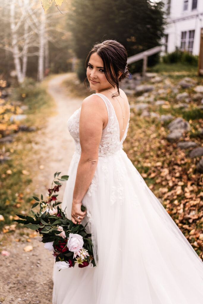 Bride walking down path with beautiful natural wedding makeup by NH Photographer Lisa Smith Photography