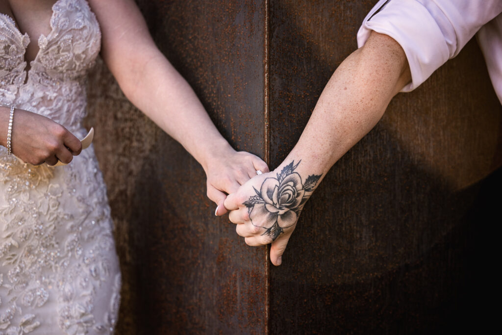 Bride and groom holding hands during first touch at Wentworth Inn wedding by NH Wedding photographer Lisa Smith Photography