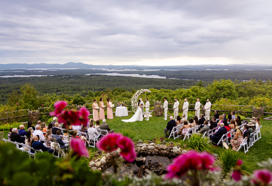 Wide angle view of wedding ceremony at Castle in the Clouds wedding venue in Moultonborough NH